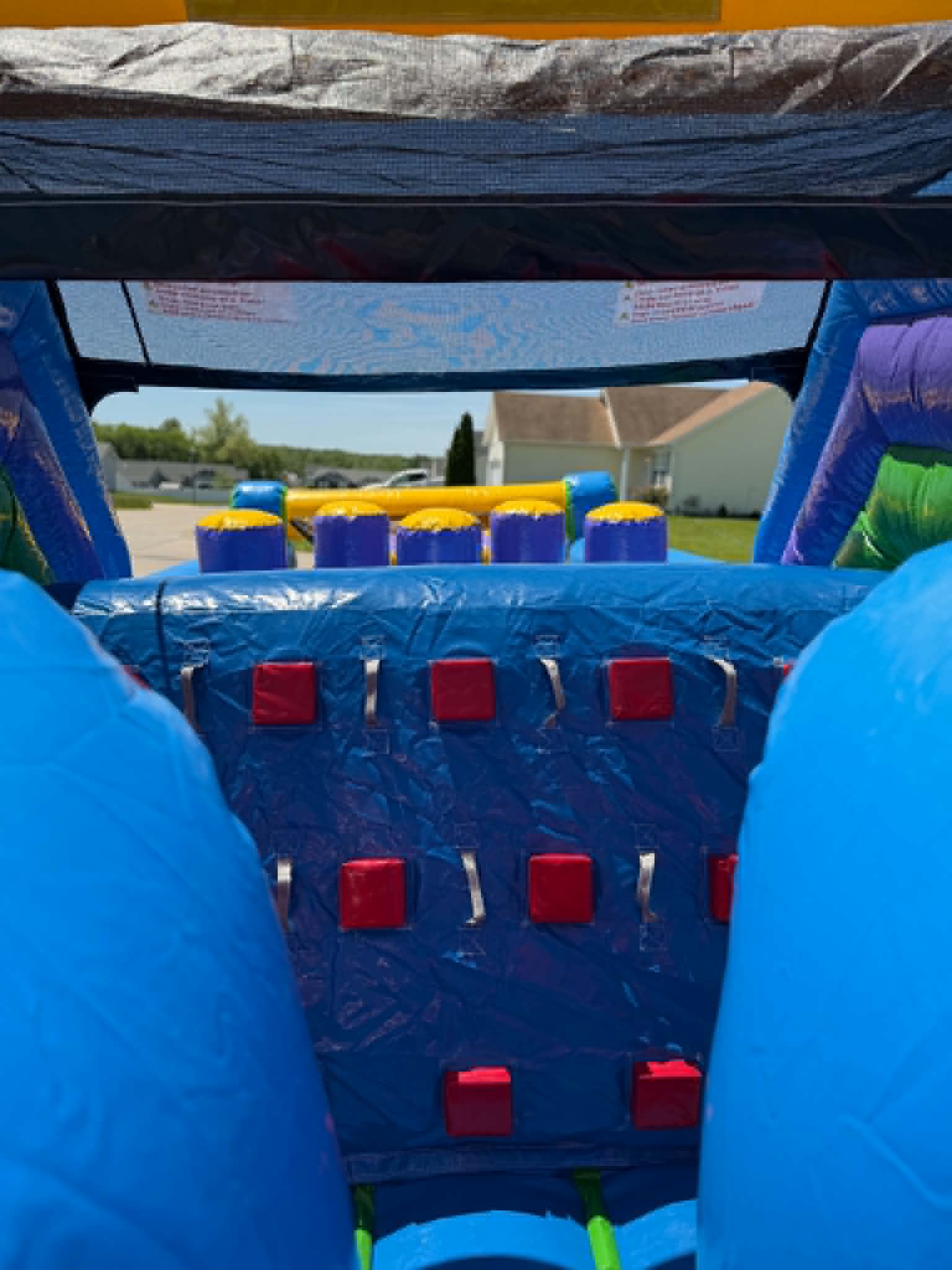 Inflatable rock climbing wall with built-in slide on the 40 foot obstacle course