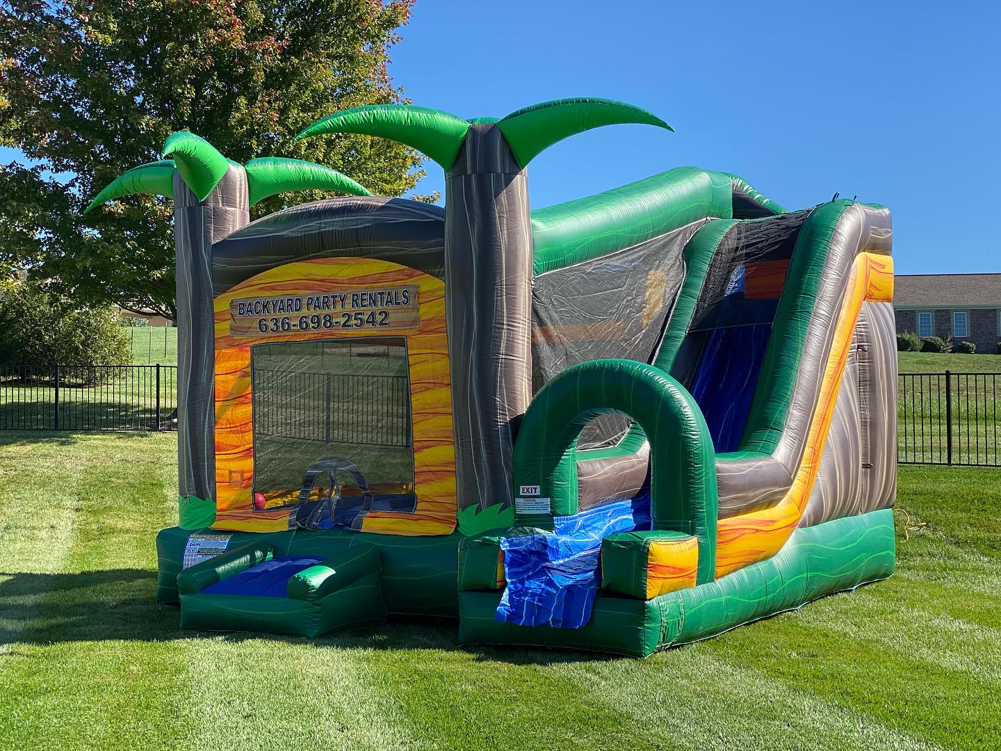 Inside view of the Paradise Palms Combo showing the tropical design and bounce area