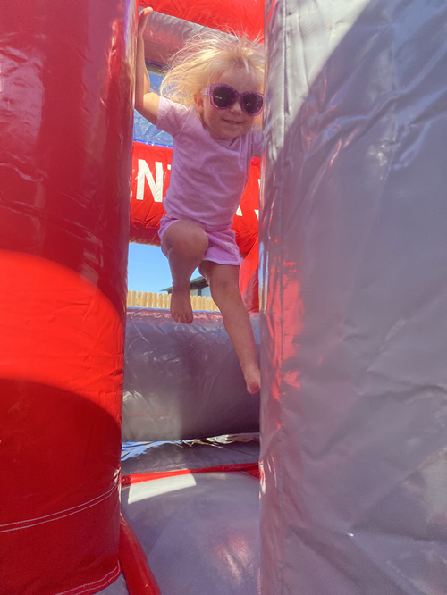 Kids on the 20' Fire & Ice Water Slide at a Backyard Party Rentals event