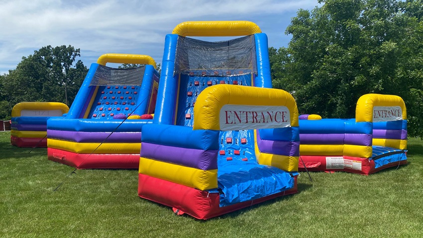 Kids on the 20' Fire & Ice Water Slide at a Backyard Party Rentals event
