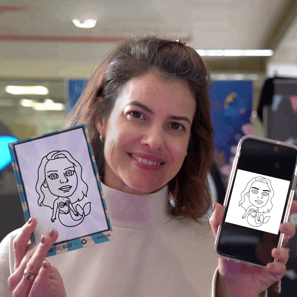 Event guest holding her finished robot-drawn caricature