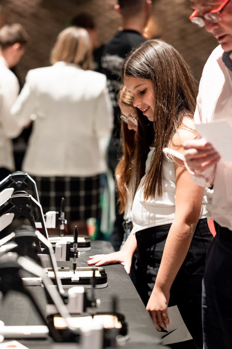 AI robot caricature station set up at a cocktail party venue