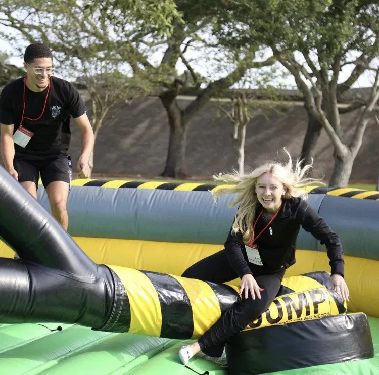Wipeout inflatable game at a school field day